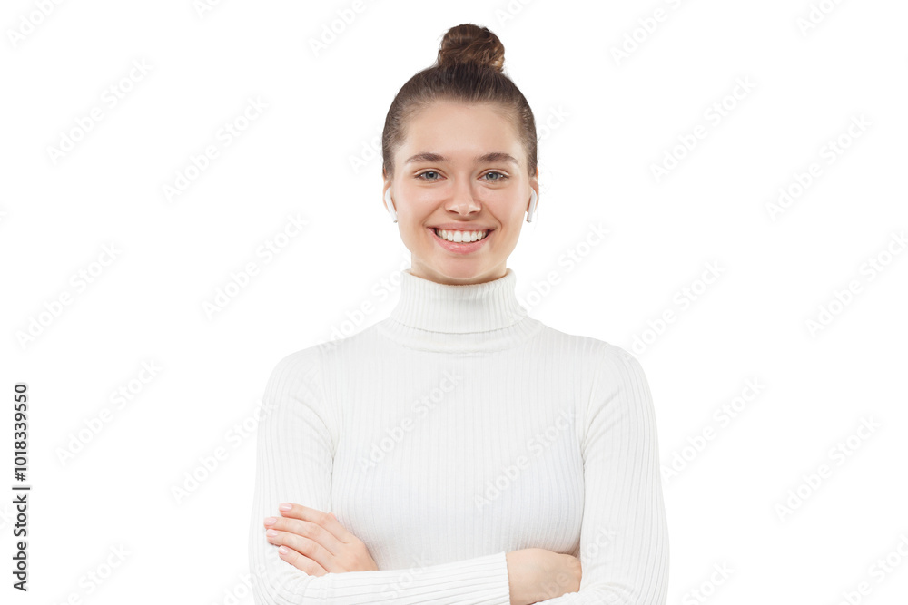 Young woman dressed in white turtleneck with tied hairstyle, standing with crossed arms and confident happy smile Young woman dressed in white turtleneck with tied hairstyle, standing with crossed arms and confident happy smile