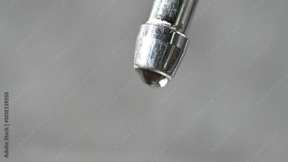 extreme close up dripping water from faucet. leaking tap. waste water. drops of water dripping from tap. leaky valve. save water concept. save budget extreme close up dripping water from faucet. leaking tap. waste water. drops of water dripping from tap. leaky valve. save water concept. save budget