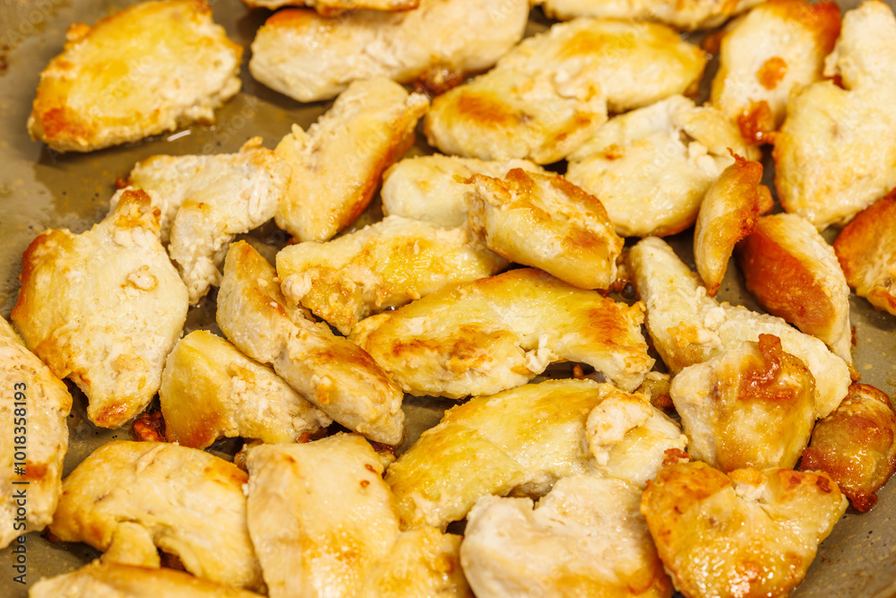 closeup full-frame background of roasting chicken breast white meat closeup full-frame background of roasting chicken breast white meat