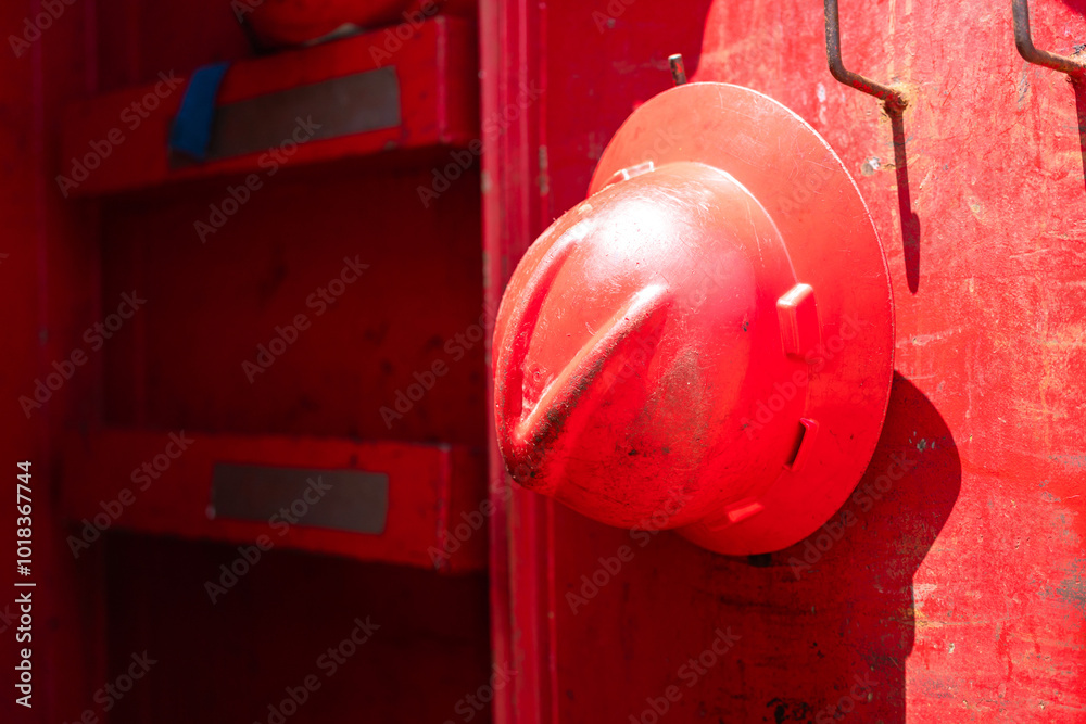 A safety helmet or hardhat, the safety PPE for construction worker is hanging in row. Industrial working equipment object, close-up. A safety helmet or hardhat, the safety PPE for construction worker is hanging in row. Industrial working equipment object, close-up.