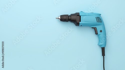 A Blue Electric Drill on a Light Blue Background Ready for Assembly Projects or Repairs