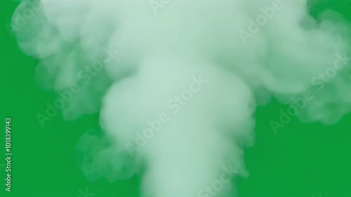 White smoke billows swiftly against a green screen backdrop, serving as an excellent element for visual effects and compositing projects, enhancing a variety of creative designs