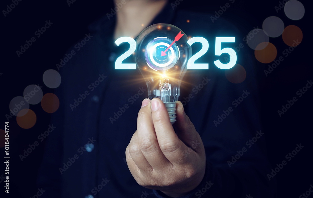 © Bird Photographer TH - businessman holding light blub with target 2024 to 2025 for preparation happy new year concept. new business in new years, start up, action plan and strategy in new business. © Bird Photographer TH - businessman holding light blub with target 2024 to 2025 for preparation happy new year concept. new business in new years, start up, action plan and strategy in new business.