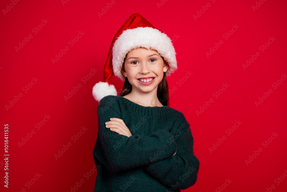 Photo portrait of charming little girl crossed hands dressed green christmas garment celebrate winter holidays on red background Photo portrait of charming little girl crossed hands dressed green christmas garment celebrate winter holidays on red background