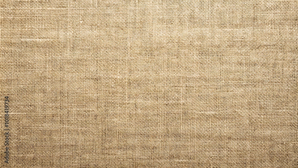 Natural linen textured background with earthy tones Natural linen textured background with earthy tones