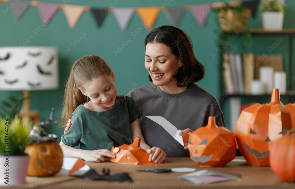 Happy family preparing for Halloween. Happy family preparing for Halloween.