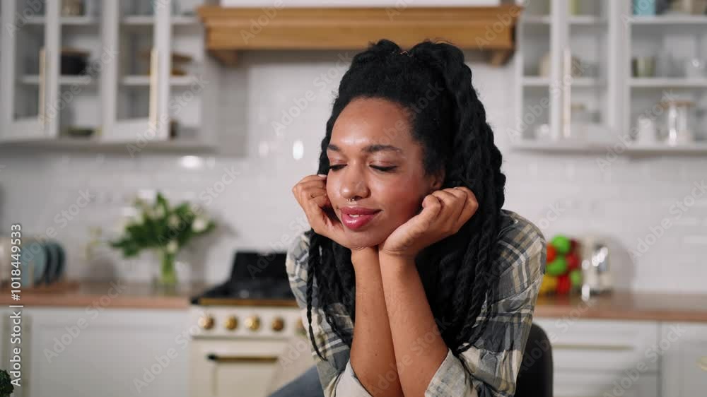 Healthy lifestyle and organic food, woman looking at table with vegetables. Portrait of African American girl sitting in kitchen and smiling, vegetarian or vegan cuisine, raw food diet, lose weight Healthy lifestyle and organic food, woman looking at table with vegetables. Portrait of African American girl sitting in kitchen and smiling, vegetarian or vegan cuisine, raw food diet, lose weight