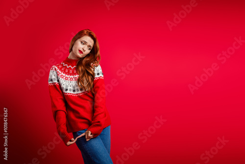 Full length body photo of funny cute modest girl wearing xmas sweater posing candid near billboard christmas sale isolated on red color background