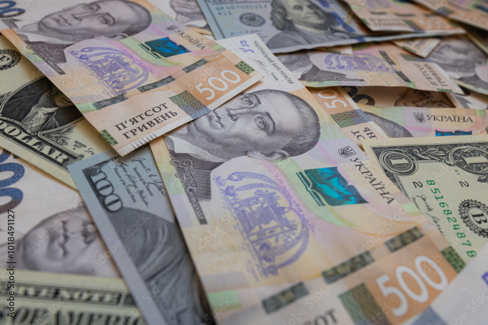 Obraz premium dollar and 500 hryvnyas banknotes background