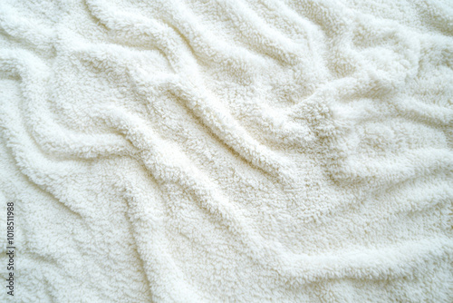 A soft, absorbent white terrycloth texture with looped cotton fibers, commonly used in towels and bathrobes