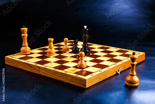 Wooden chess pieces on the chessboard. Intellectual game -chess. Chess pieces on the Board. A game of chess.