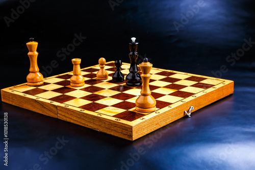 Wooden chess pieces on the chessboard. Intellectual game -chess. Chess pieces on the Board. A game of chess.