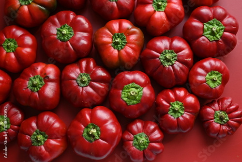 texture of red bell peppers as a background, autumn ripe juicy red bell peppers as a background, juicy organic food