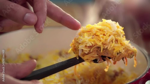 Chcken biryani showing chicken piece