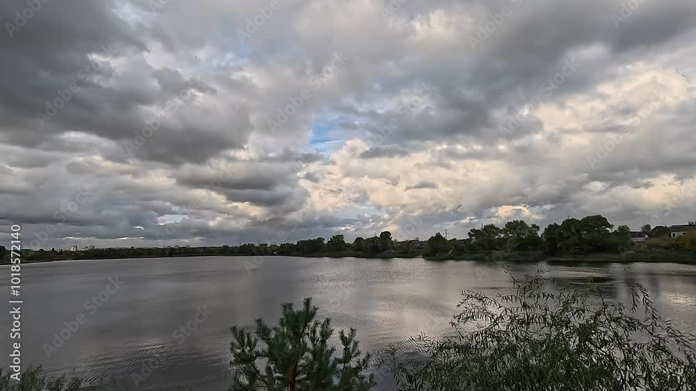 beautiful natural landscape with clouds. clouds over water. reflection in water. on the lake shore. landscape with river. river and clouds. weather before storm. hurricane. hdr video. beautiful natural landscape with clouds. clouds over water. reflection in water. on the lake shore. landscape with river. river and clouds. weather before storm. hurricane. hdr video.