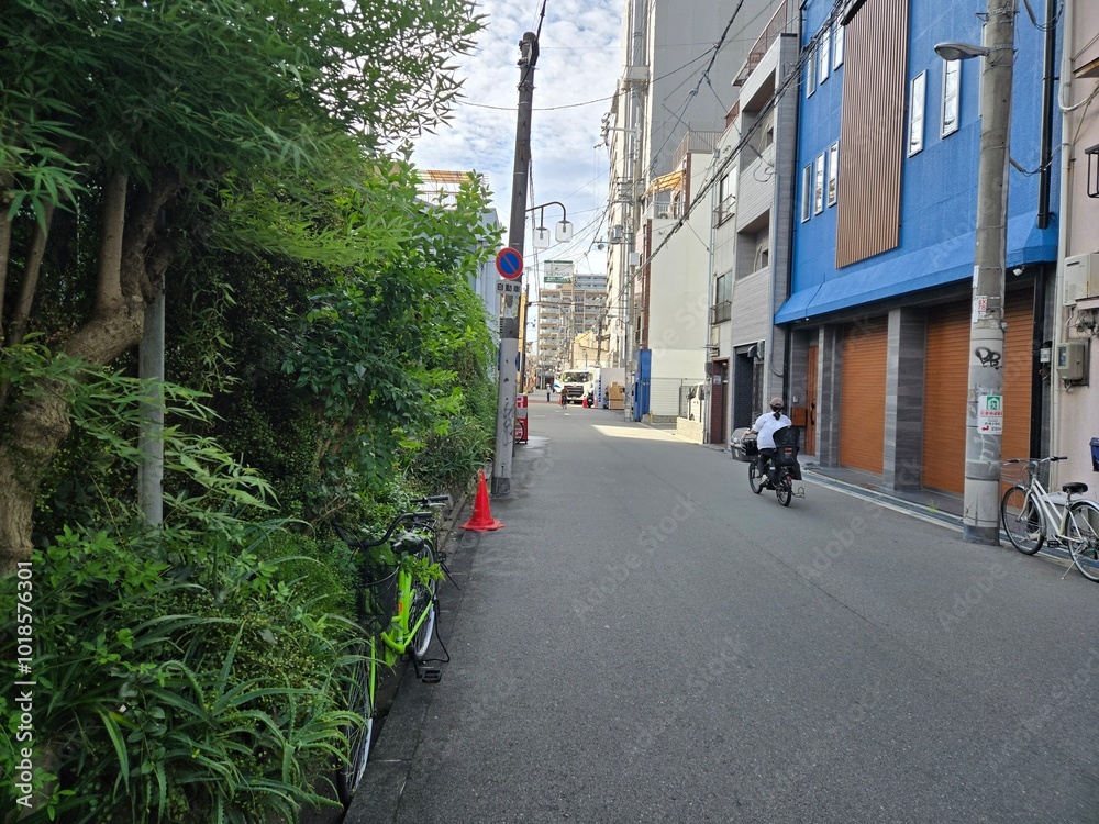 Naklejka premium Osaka, Namba, Doton,Japan, Authentic Japanese Alleyway with Shops and Urban Architecture – Empty Street with Traditional Buildings in Japan