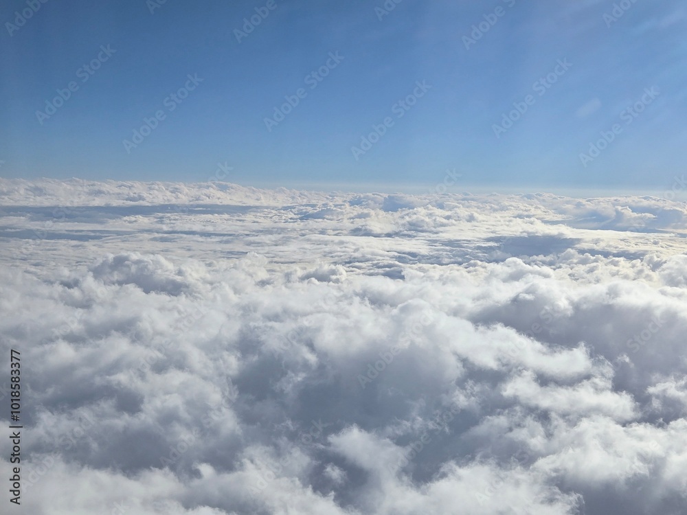 Fototapeta premium Stunning Aerial View of Clouds and Clear Blue Sky – Scenic Atmosphere, Fluffy White Clouds in the Stratosphere