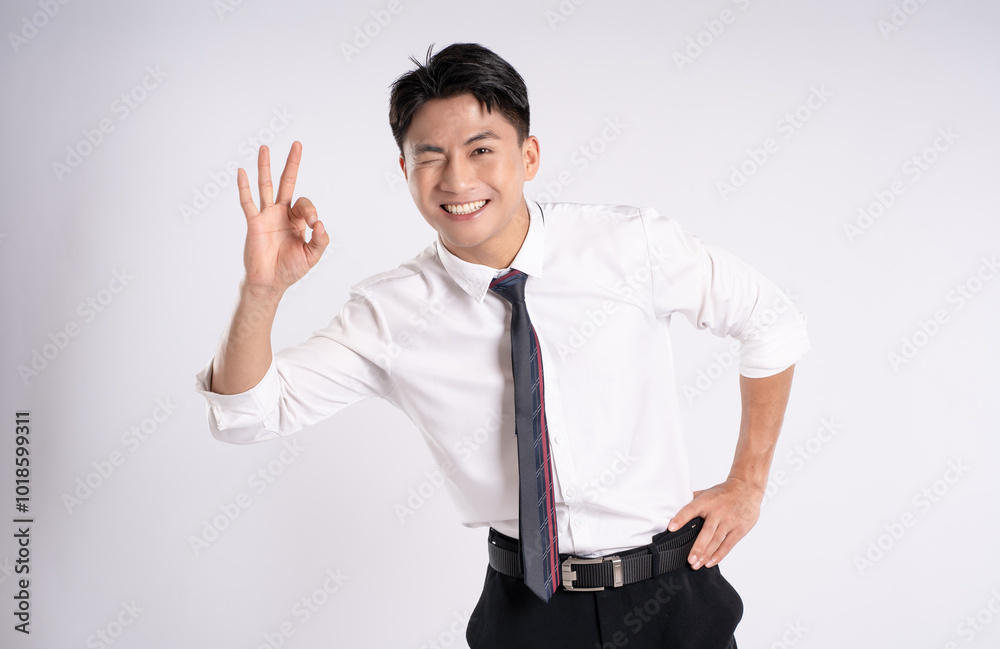 Portrait of young Asian business man posing on white background Portrait of young Asian business man posing on white background