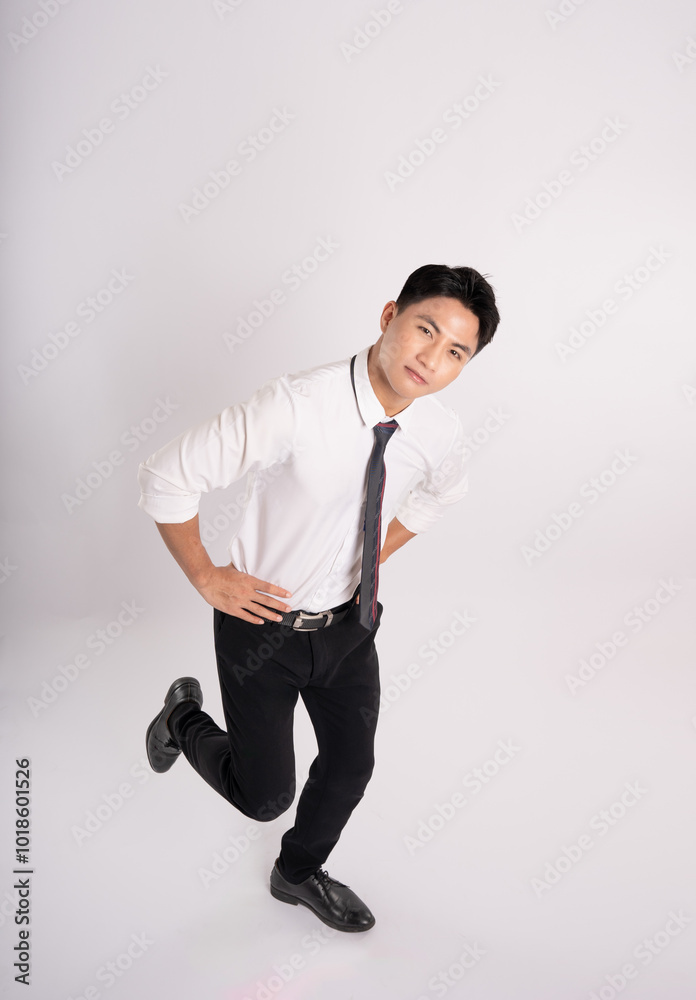 Full body of young Asian businessman posing on white background
Full body of young Asian businessman posing on white background