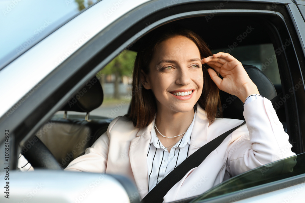 Woman holding steering wheel while driving car Woman holding steering wheel while driving car