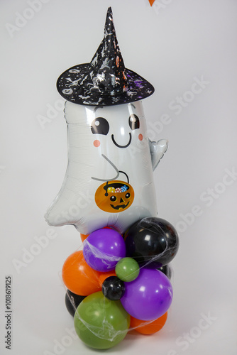 Halloween decorations made of balloons, pumpkin, cauldron and witch's broom