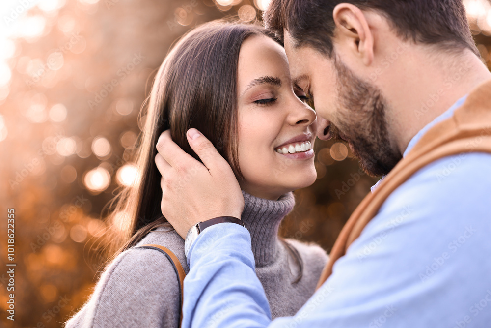 Fototapeta premium Beautiful couple spending time together outdoors on autumn day