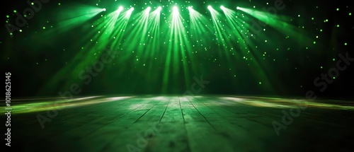Green stage lights illuminate an empty wooden stage, creating a vibrant atmosphere.