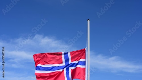 Wallpaper Mural The flag of Norway is hoisted, flutters in the wind against a blue sky and is lowered again Torontodigital.ca