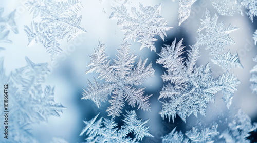 A close-up of snow and ice crystals on a window, with intricate patterns formed by the cold