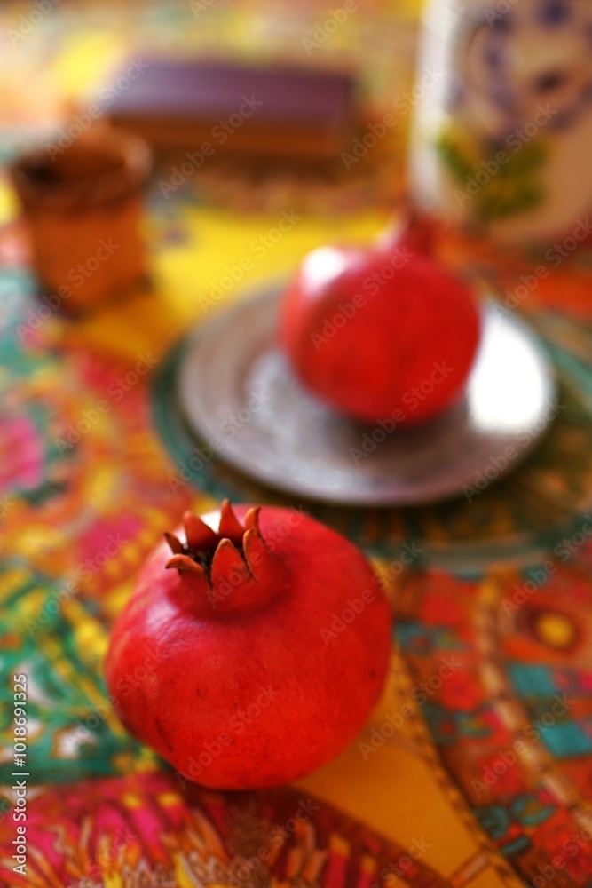 Culinary still life with pomegranates on a beautiful table Culinary still life with pomegranates on a beautiful table