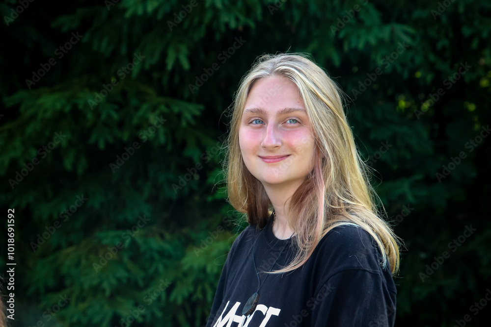 portrait of a blonde girl with blue eyes smiling in the summer in the forest, posing, mood, rest, nature, vacation, tree trip portrait of a blonde girl with blue eyes smiling in the summer in the forest, posing, mood, rest, nature, vacation, tree trip