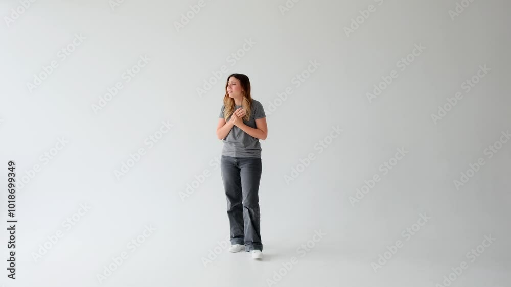 Frightened Caucasian young adult woman in grief engaged in thoughts on white background. Concept of a panic, crisis, problem, frustration. Frightened Caucasian young adult woman in grief engaged in thoughts on white background. Concept of a panic, crisis, problem, frustration.