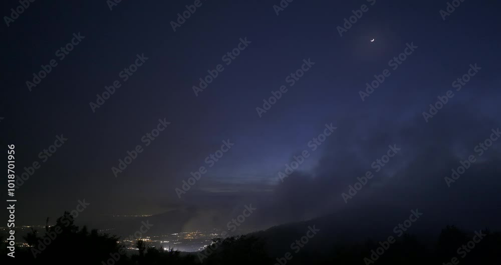 View of Gotemba city and the crescent moon from the foggy Hakone mountains in Japan. 4K,H.264,422,10bit. View of Gotemba city and the crescent moon from the foggy Hakone mountains in Japan. 4K,H.264,422,10bit.