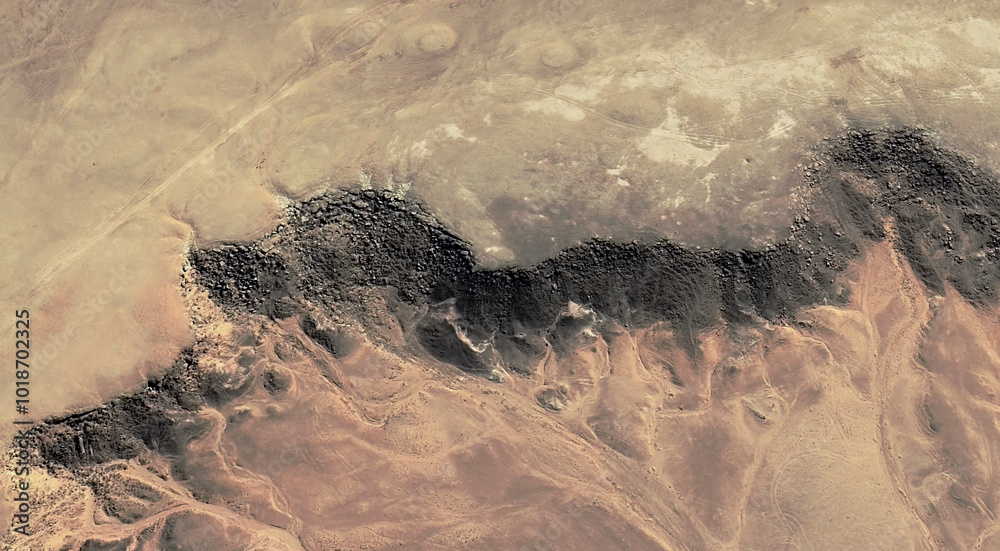 The landscape of the sandy desert in Qatar from a bird's eye view