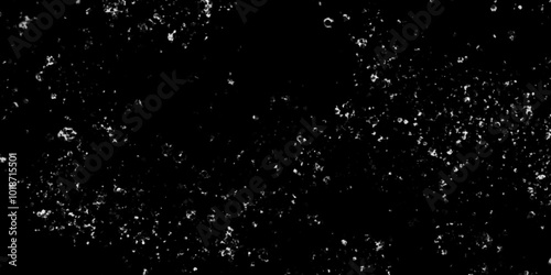 Falling realistic natural snowflakes on black background, The texture of white snow during a snowfall with various randomized snowflakes, white particles on black.