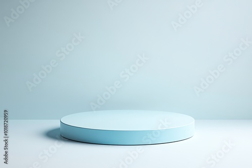 A single white round object sits on a white surface, perfect for minimalist designs and backgrounds