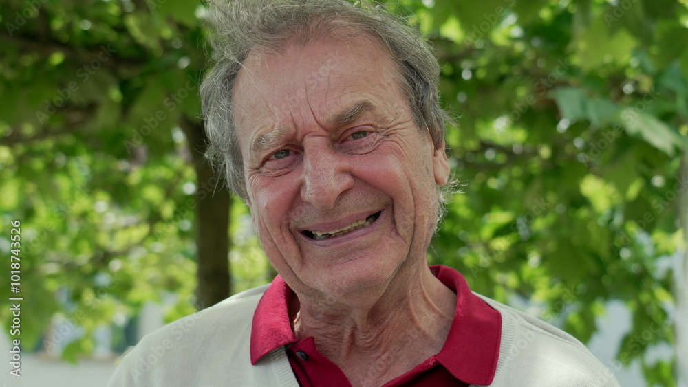 Elderly man outdoors with a broad smile, radiating joy and positivity, showing deep laugh lines and an expressive face. A moment of genuine happiness captured in a natural setting Elderly man outdoors with a broad smile, radiating joy and positivity, showing deep laugh lines and an expressive face. A moment of genuine happiness captured in a natural setting