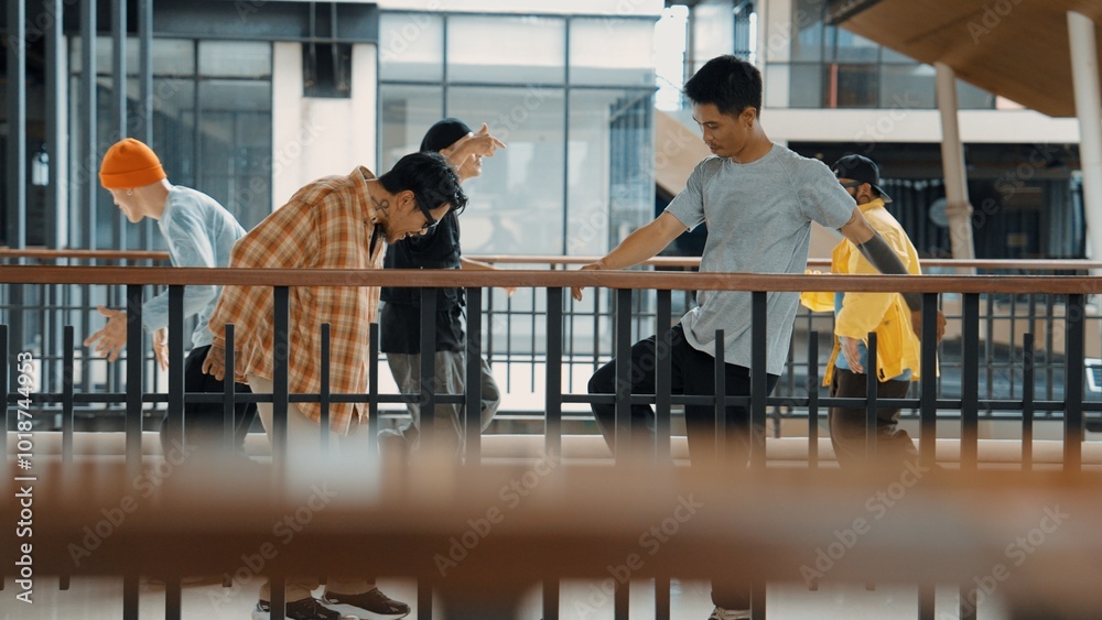 Multicultural hipster group walking while dancing at modern corridor. Attractive break dance team happy and joy while moving to hip-hop music. Active. Site view. Outdoor sport 2024. Hiphop. Multicultural hipster group walking while dancing at modern corridor. Attractive break dance team happy and joy while moving to hip-hop music. Active. Site view. Outdoor sport 2024. Hiphop.