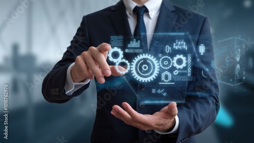 Wallpaper Mural A business professional using futuristic technology to manage data and analytics, showcasing gears and digital interfaces, with a blurred office background. Torontodigital.ca