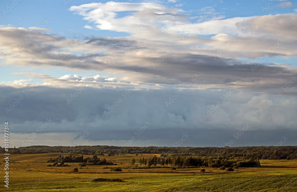 Obraz premium Dramatic sky over the fields. Agricultural landscape in eastern Lithuania.