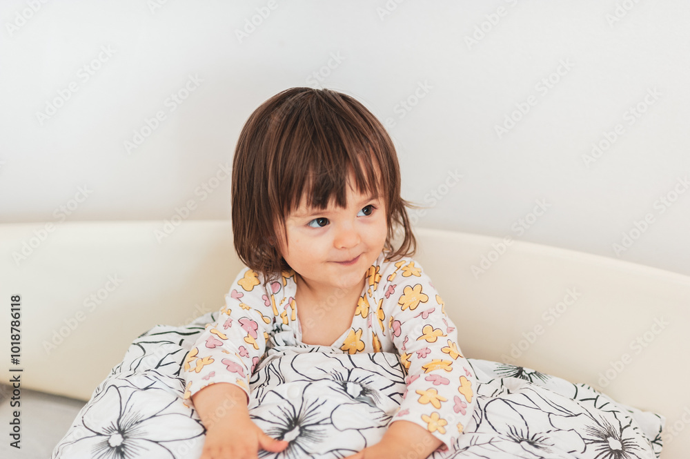 Pillow fight time, a little baby-girl loves playing with her pillow Pillow fight time, a little baby-girl loves playing with her pillow