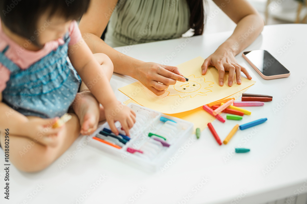mother and daughter drawing in notebook mother and daughter drawing in notebook