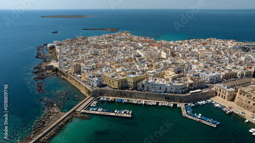 Aerial view of the historic center of Gallipoli, a city in the province of Lecce, in Puglia, Italy. The old town is located along the western coast of Salento, overlooking the Mediterranean Sea.