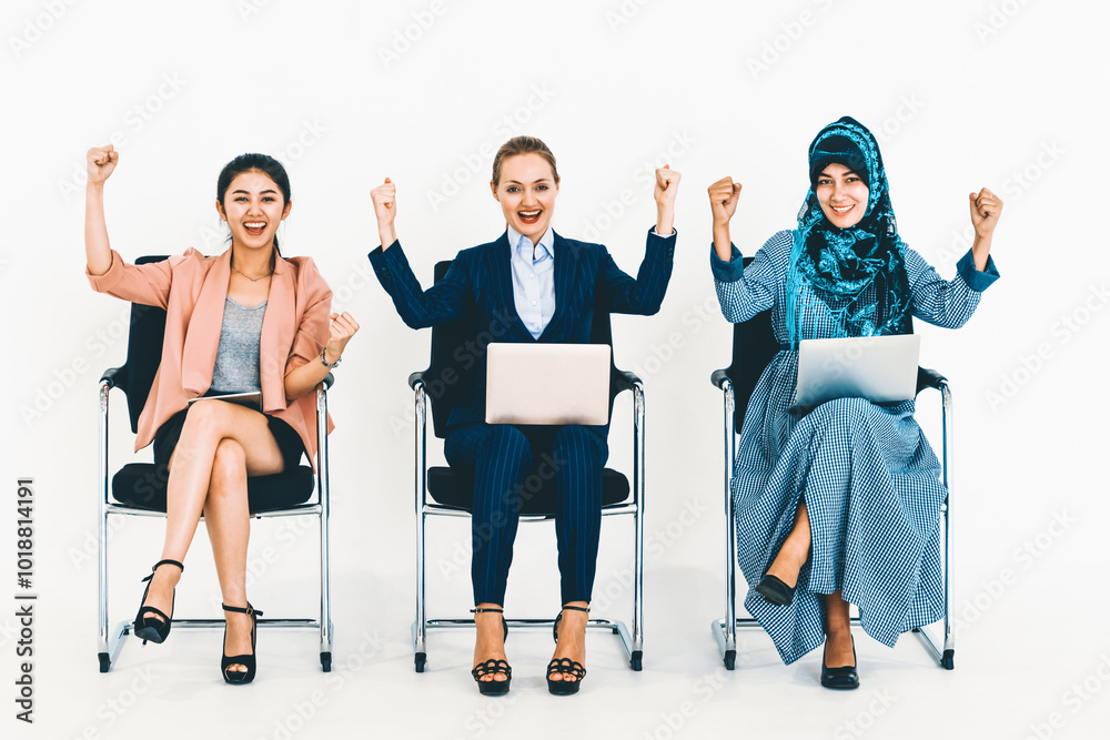 Obraz premium Happy young businesswomen group celebrating work success together. Workplace community and human resources concept. uds
