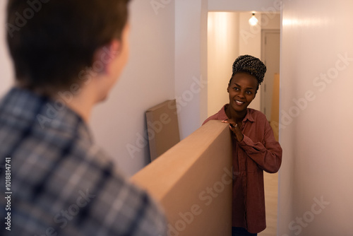 Diverse couple moving in