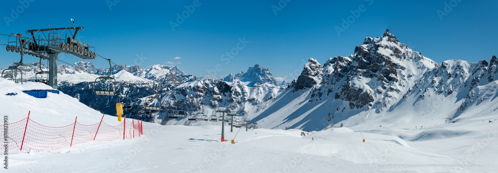 Ski lift and ski runs in Arabba ski resort in Dolomites, Italy
