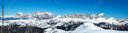 Obraz na płótnie Wide winter panorama of mountain range in Italian Dolomites viewed from the slopes in Arabba ski resort w salonie