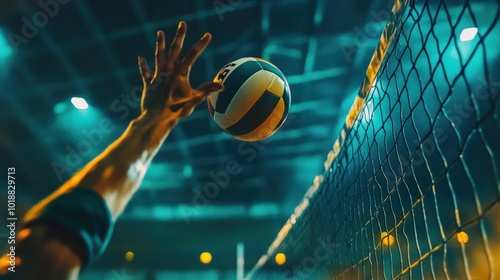 Obraz na płótnie Close-up of a volleyball player's hand reaching for the ball during a game. w salonie