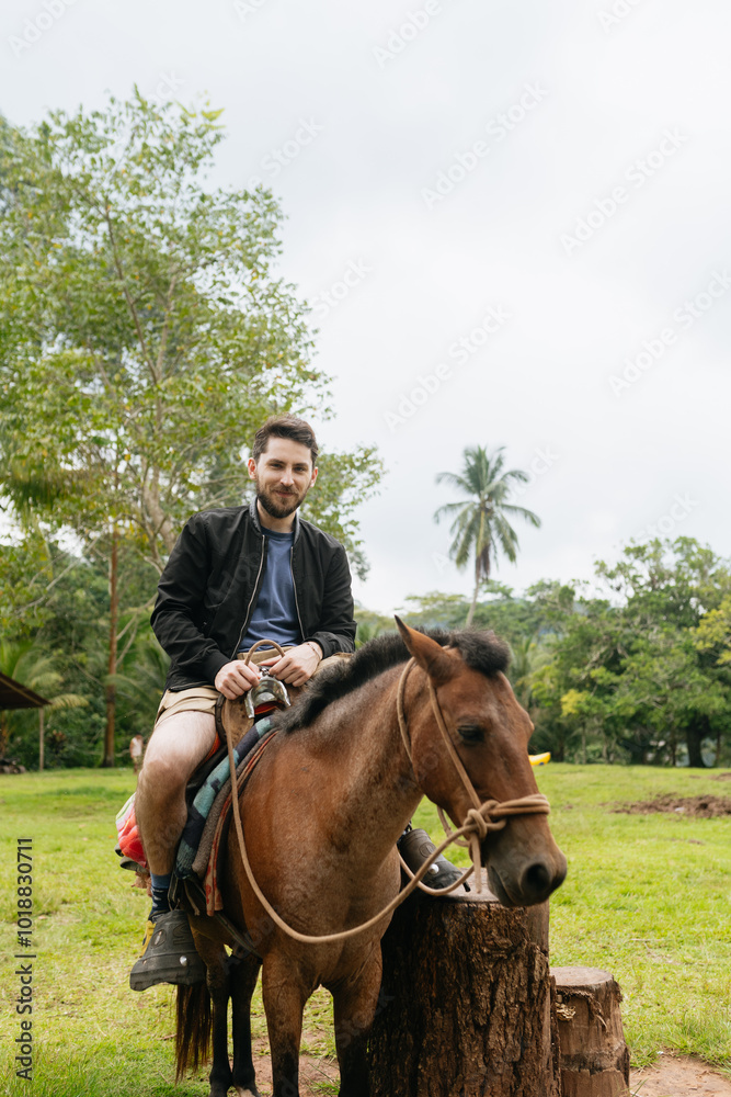 Man Riding Horse in Jungle Setting Man Riding Horse in Jungle Setting