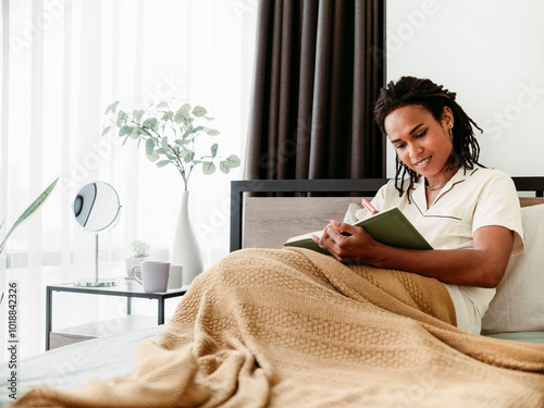 Beautiful Black Woman Writing a Diary  photo